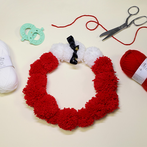 Confectionner sa couronne de noël en pompons